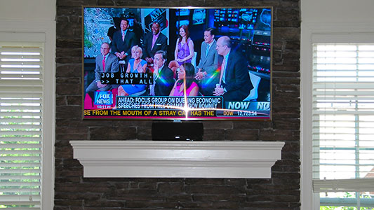 stone tv installation above mantel
