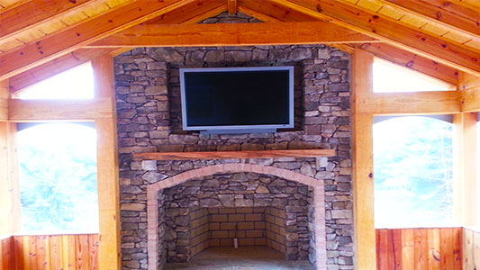 above the fireplace tv installation on stone 10