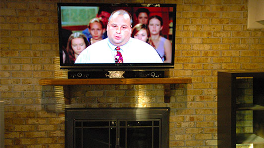 brick tv installation above mantel